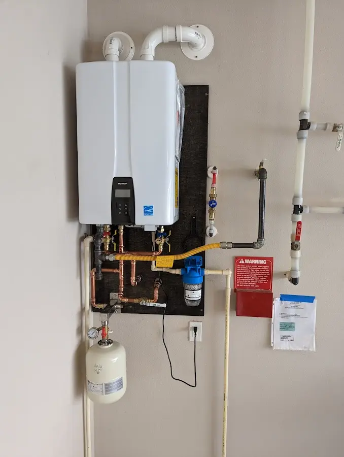 Professional plumber installing copper piping in a Tara Hills home